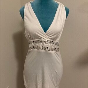 White bodycon dress with silver sequin belt and tie back detail